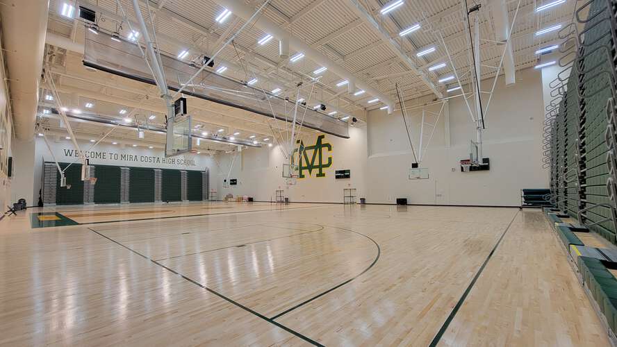 Mira Costa High School gym with polished floors, ideal for sports events and workshops.