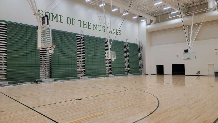 Mira Costa High School gym with hardwood floor, ideal for sports events and gatherings.