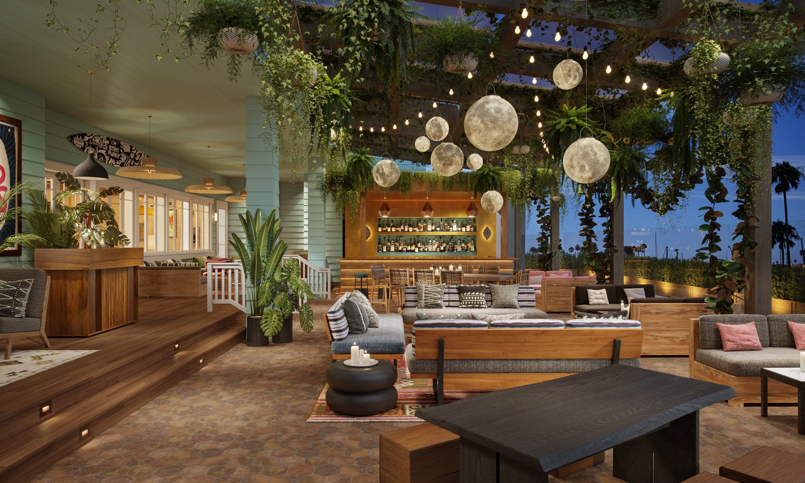 Elegant event space at The Bungalow Long Beach with lush greenery and cozy seating.