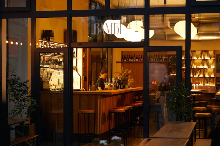 Stylish bar setting with warm lighting, perfect for cocktail receptions and networking events.