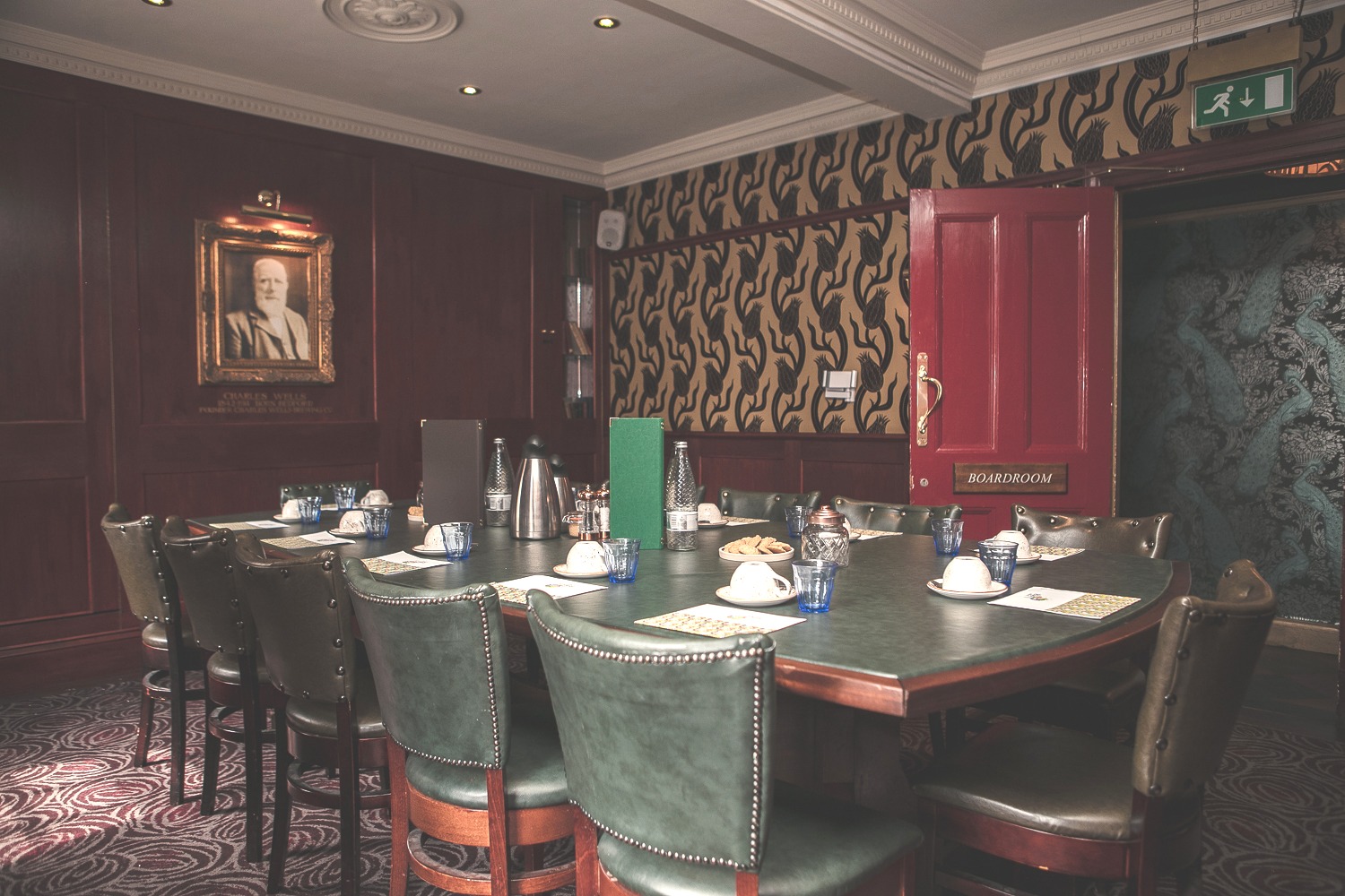 Elegant meeting room with dark wood paneling, ideal for executive gatherings and discussions.