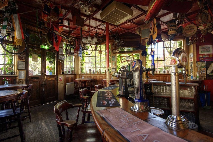 Cozy rustic pub bar at Faltering Fullback, ideal for networking and team-building events.