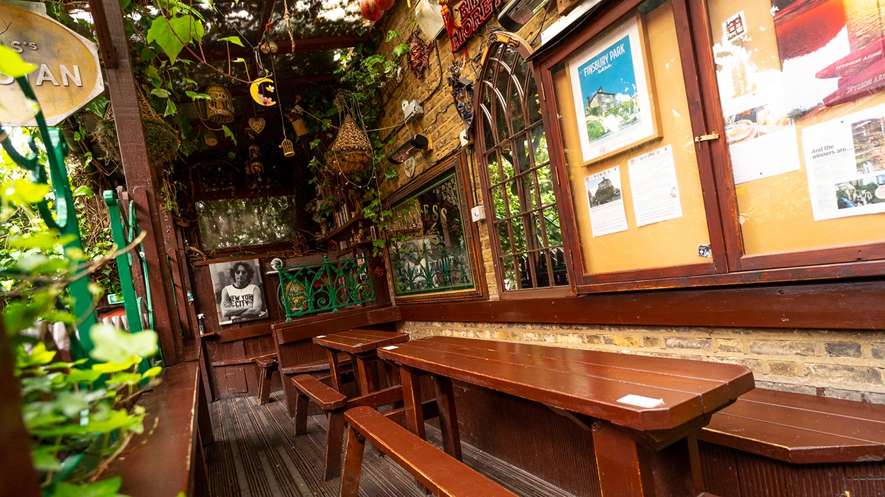 Cozy rustic bar with wooden benches, ideal for intimate gatherings and team-building events.