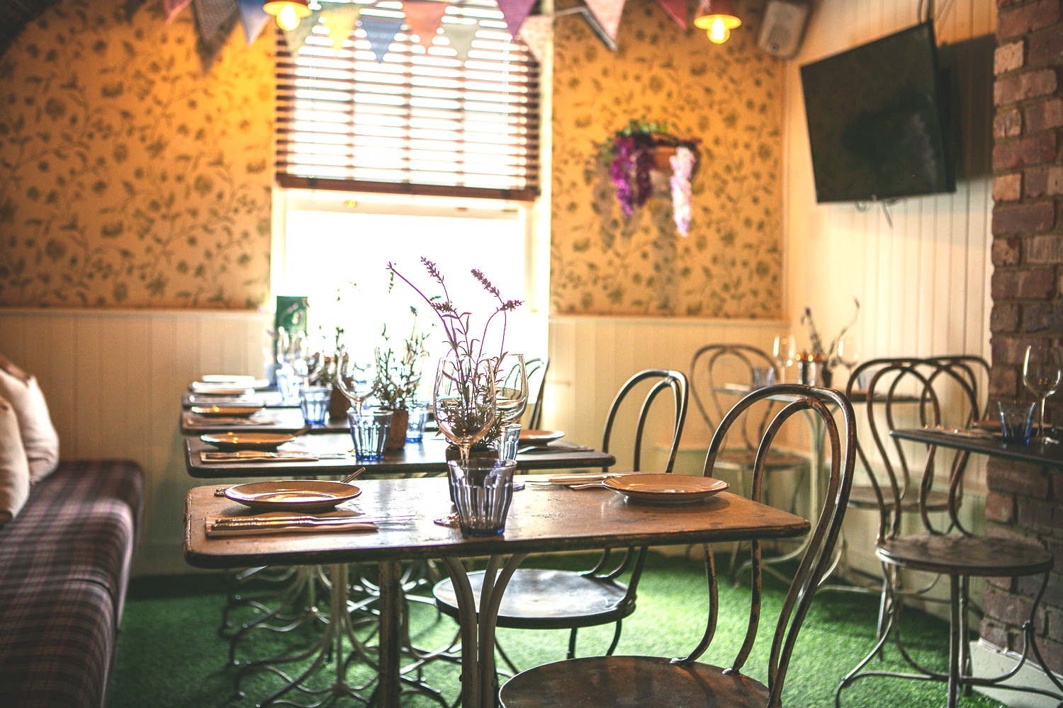 Intimate dining space with rustic decor for small gatherings at The Somers Town Coffee House.