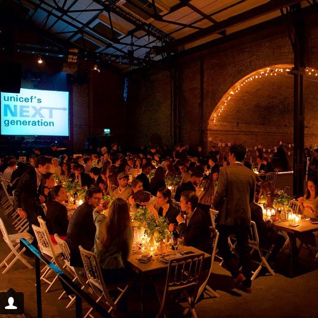 Vibrant event setup at Village Underground with communal tables and warm lighting for networking.