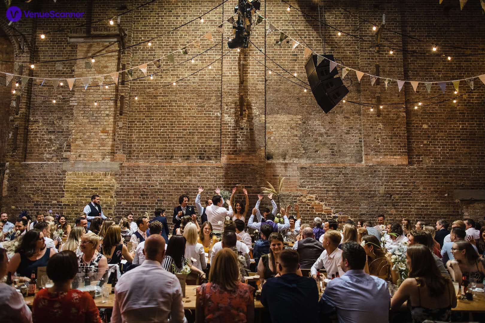 Vibrant Village Underground event space with rustic walls, ideal for networking and celebrations.