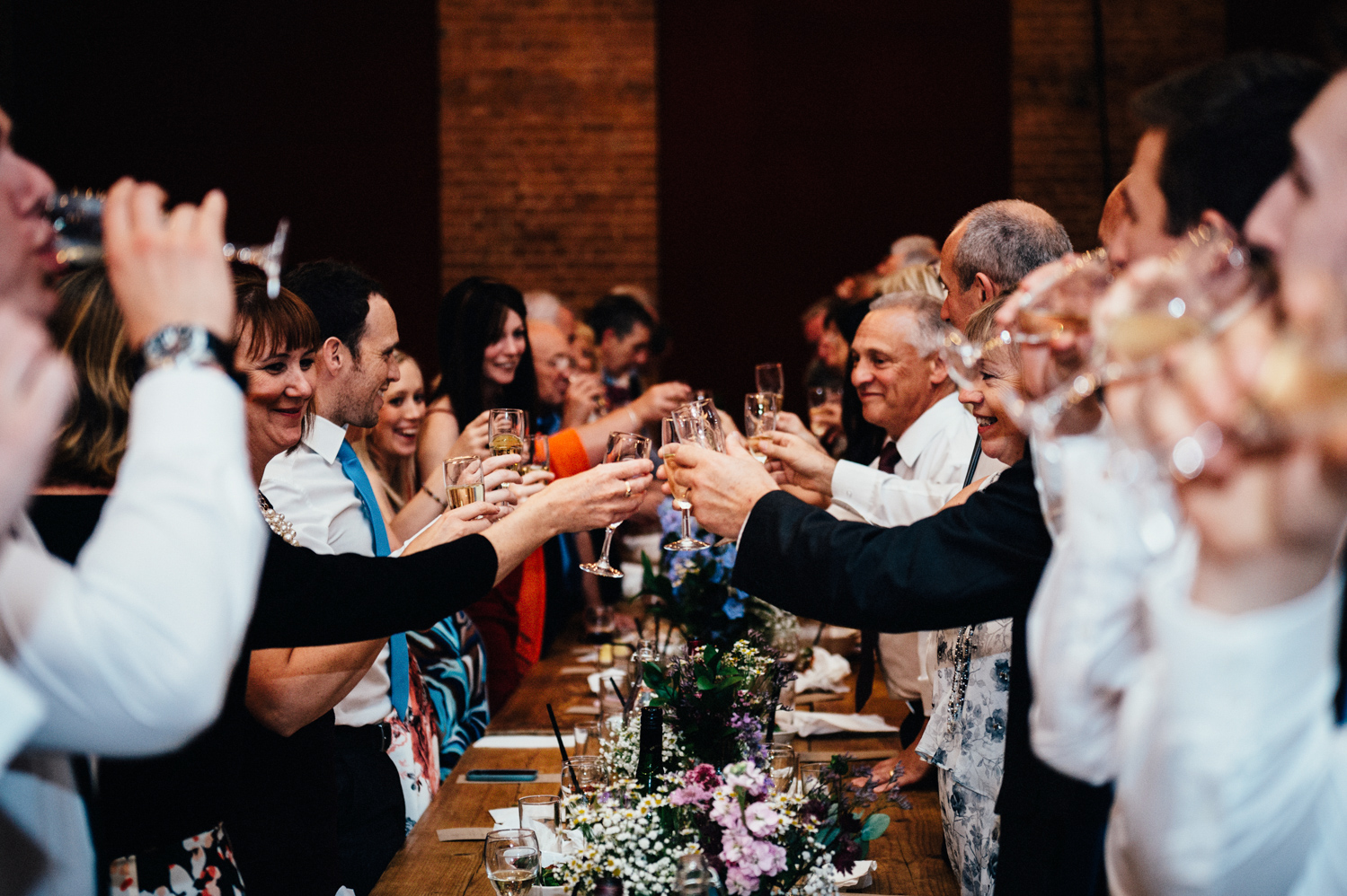 Wedding reception celebration at Village Underground with elegant floral arrangements.
