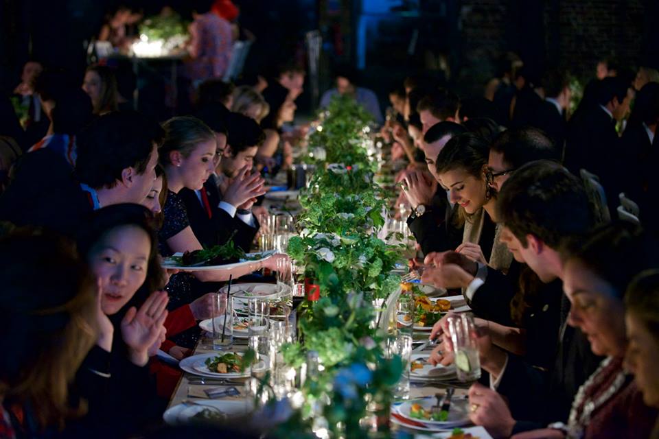 Elegant dining table in Village Underground for networking event with lush greenery centerpieces.