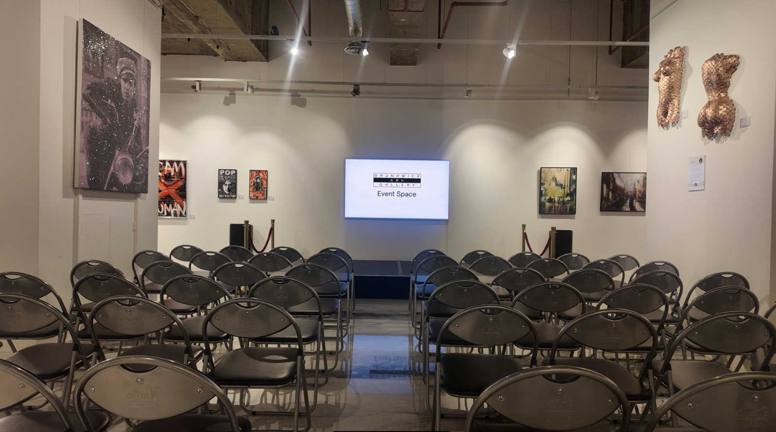 Brunswick Art Gallery event space set up for a seminar with projector and artwork.