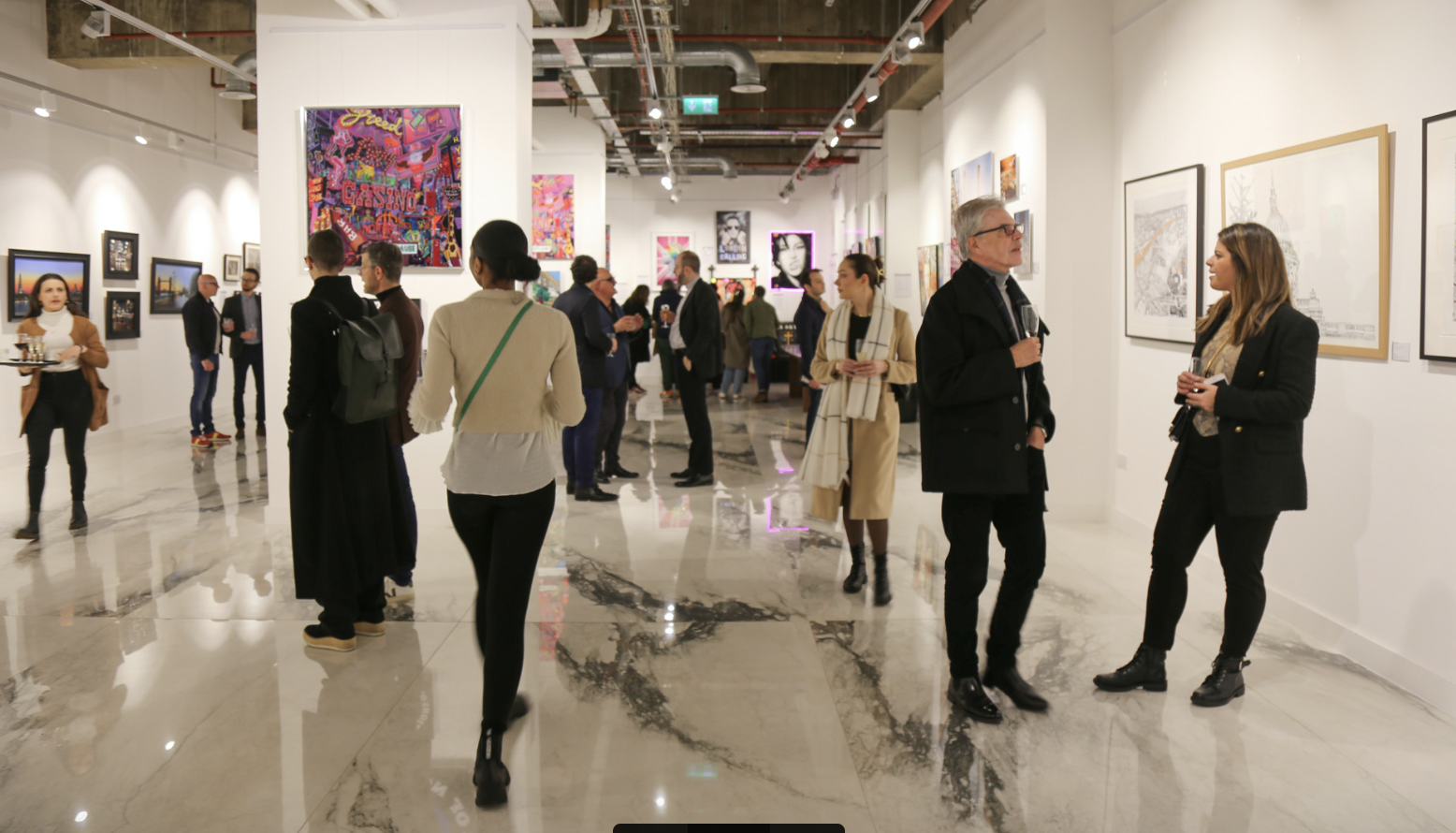 Vibrant Brunswick Art Gallery event with diverse artwork and networking attendees.