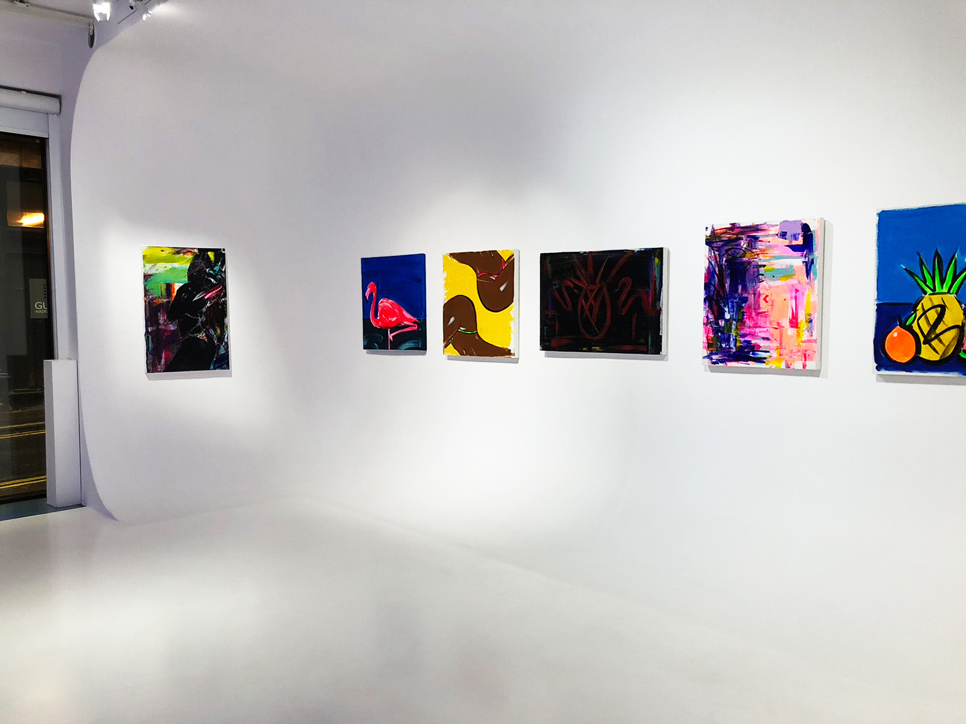 Modern gallery with vibrant artworks, ideal for art exhibitions and networking events.