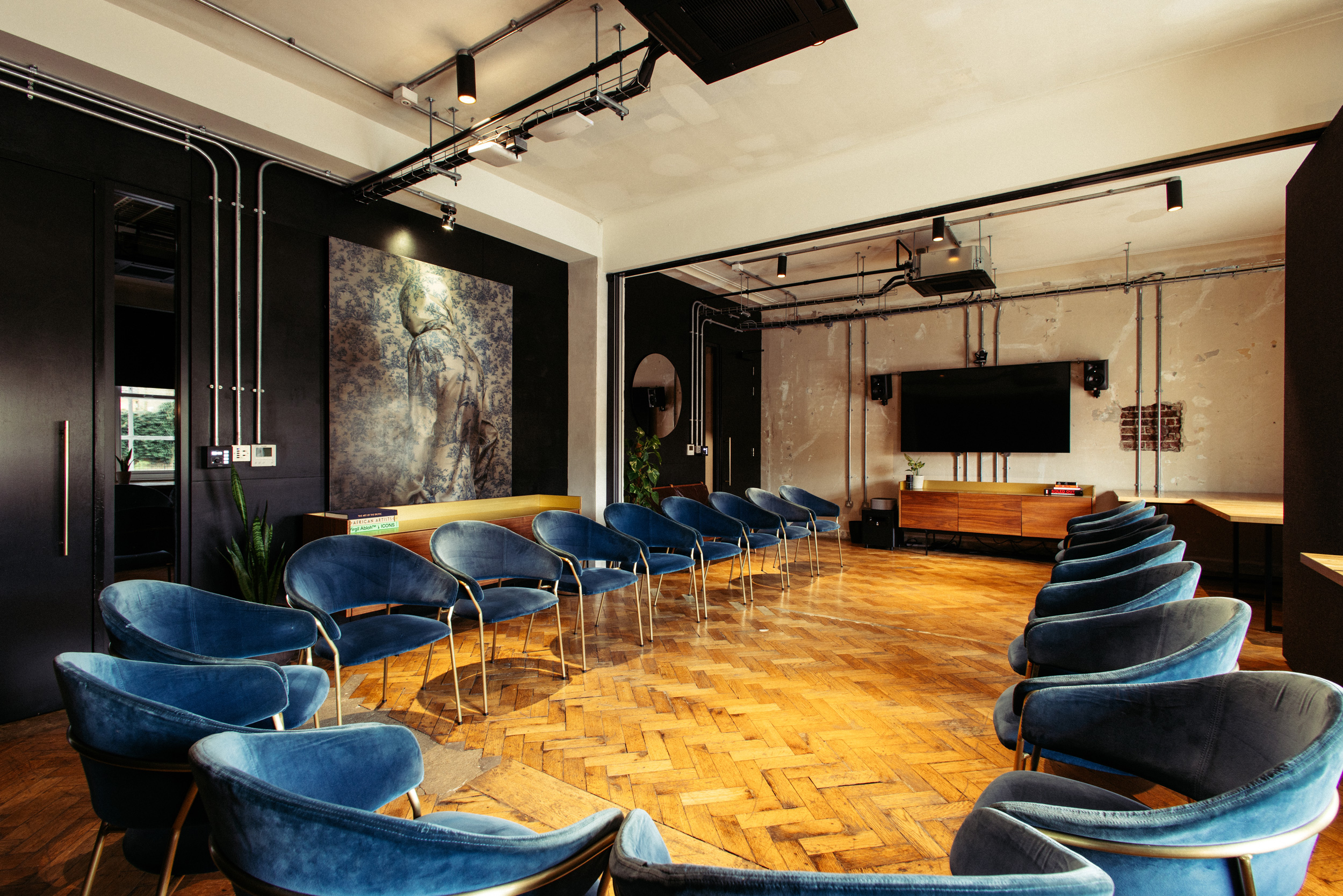 Modern workshop event space, industrial chic, natural light, tech