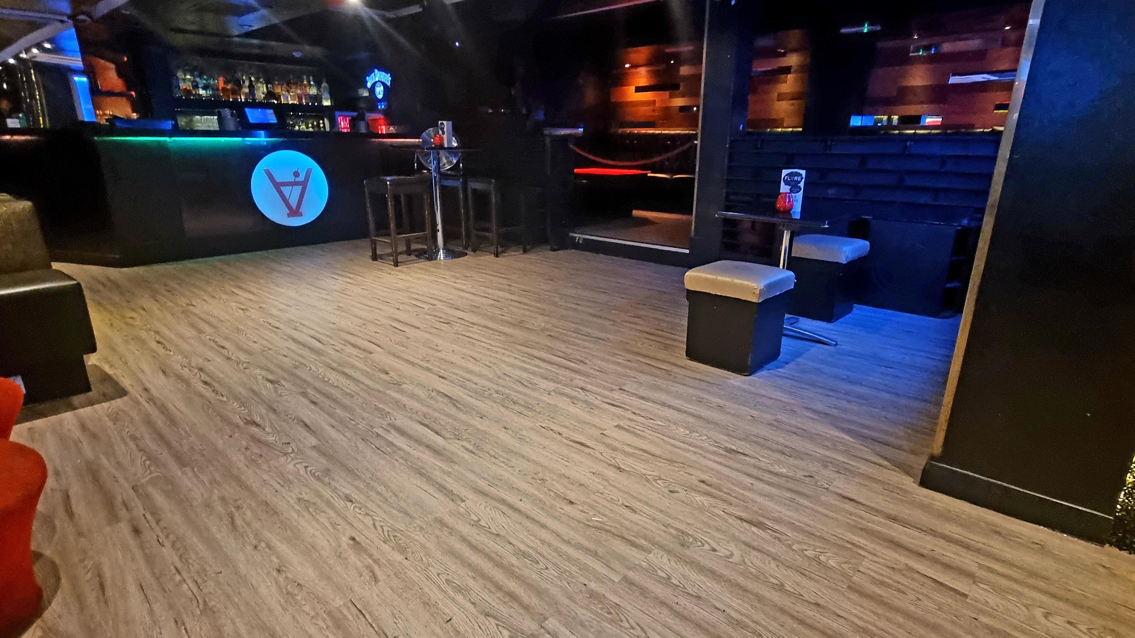 Private party venue with stylish seating and ambient lighting for events.