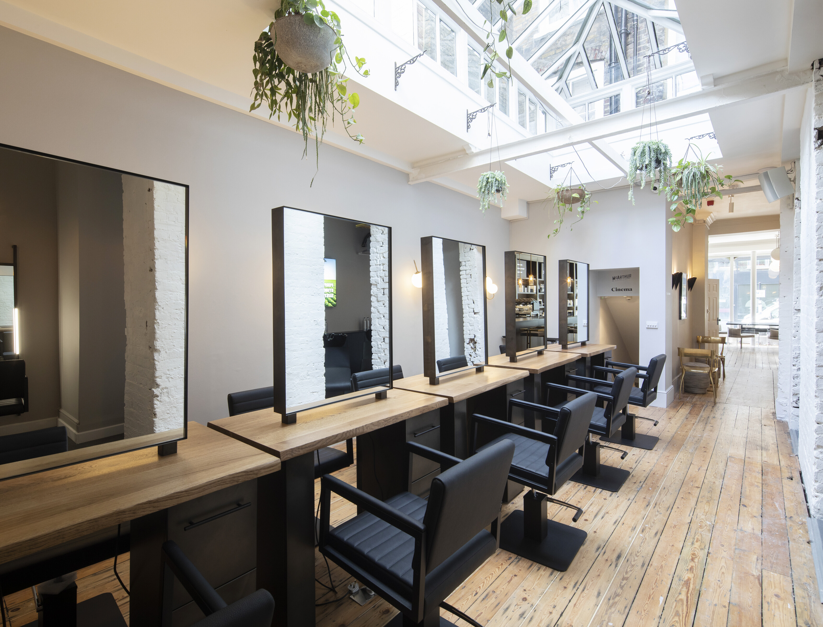 Modern salon with sleek styling stations, perfect for beauty events and workshops.
