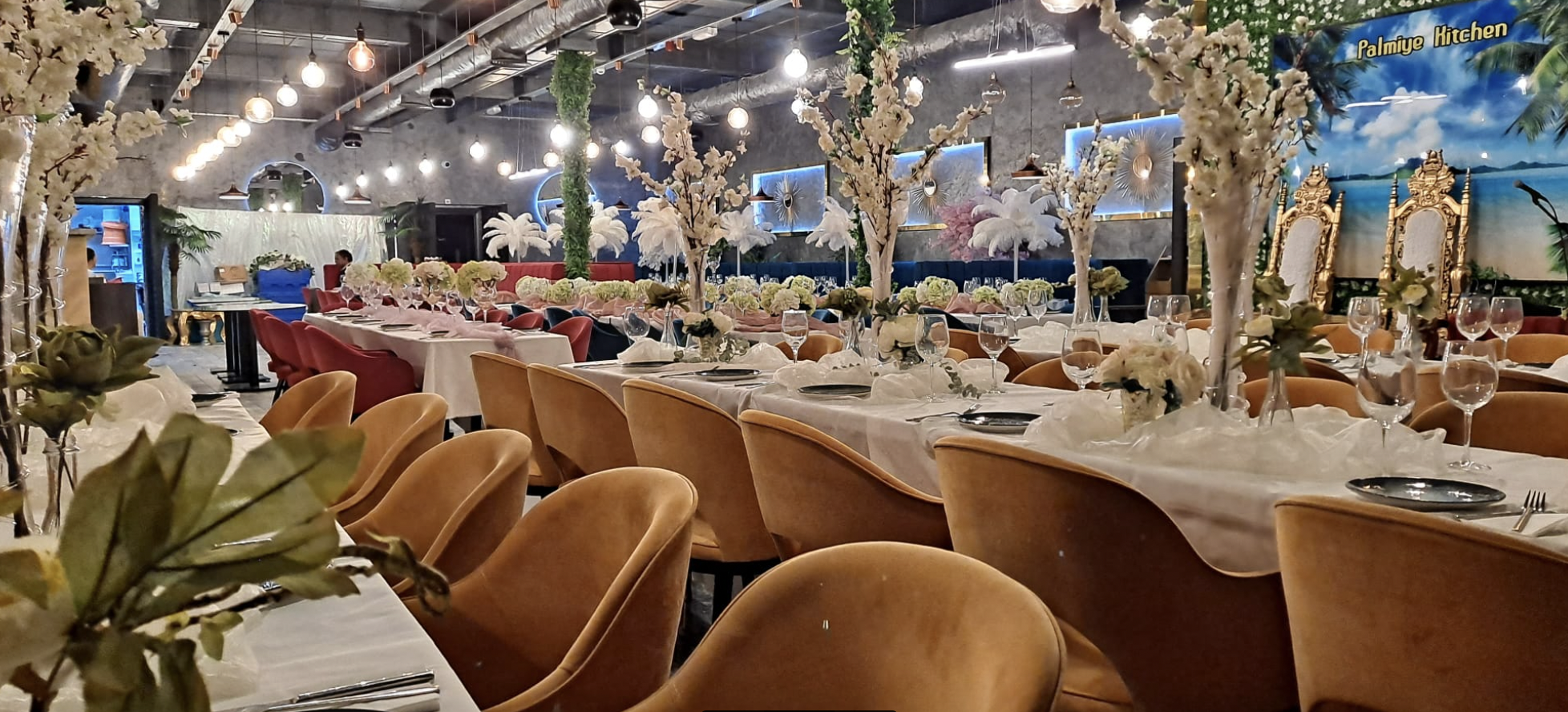 Elegant Palm Banquet Suite with floral centerpieces for upscale events and celebrations.