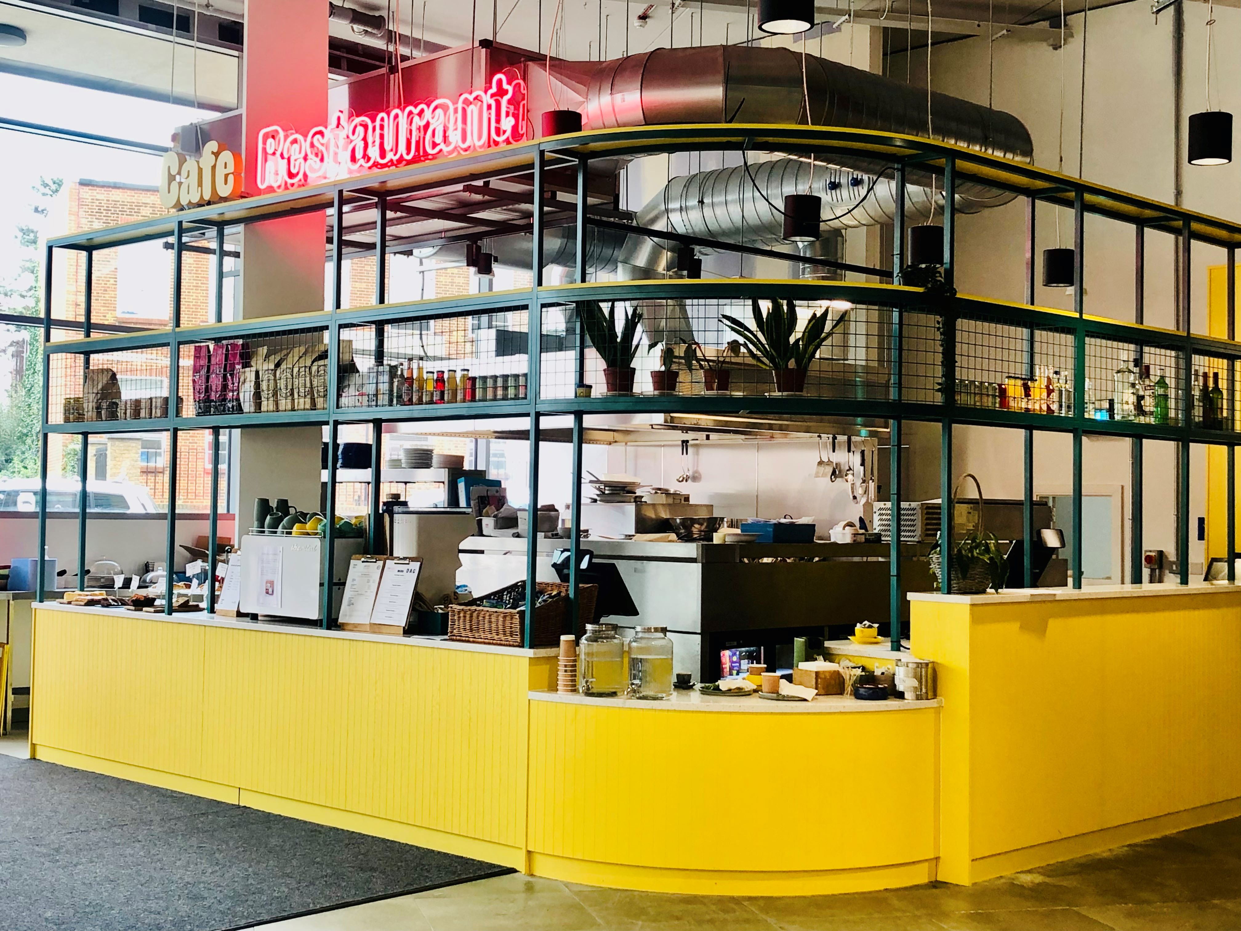 Tiered seating area with bright yellow accents for casual meetings at Dugdale Arts Centre.