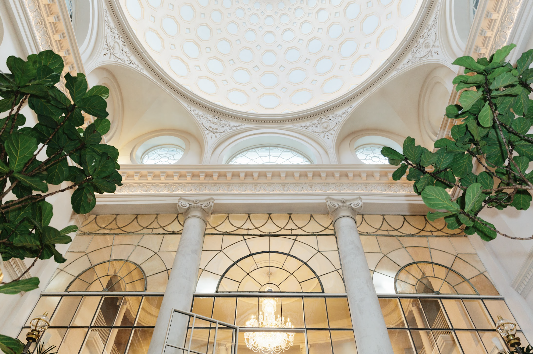 Elegant venue with grand ceiling, ideal for upscale corporate events and receptions.