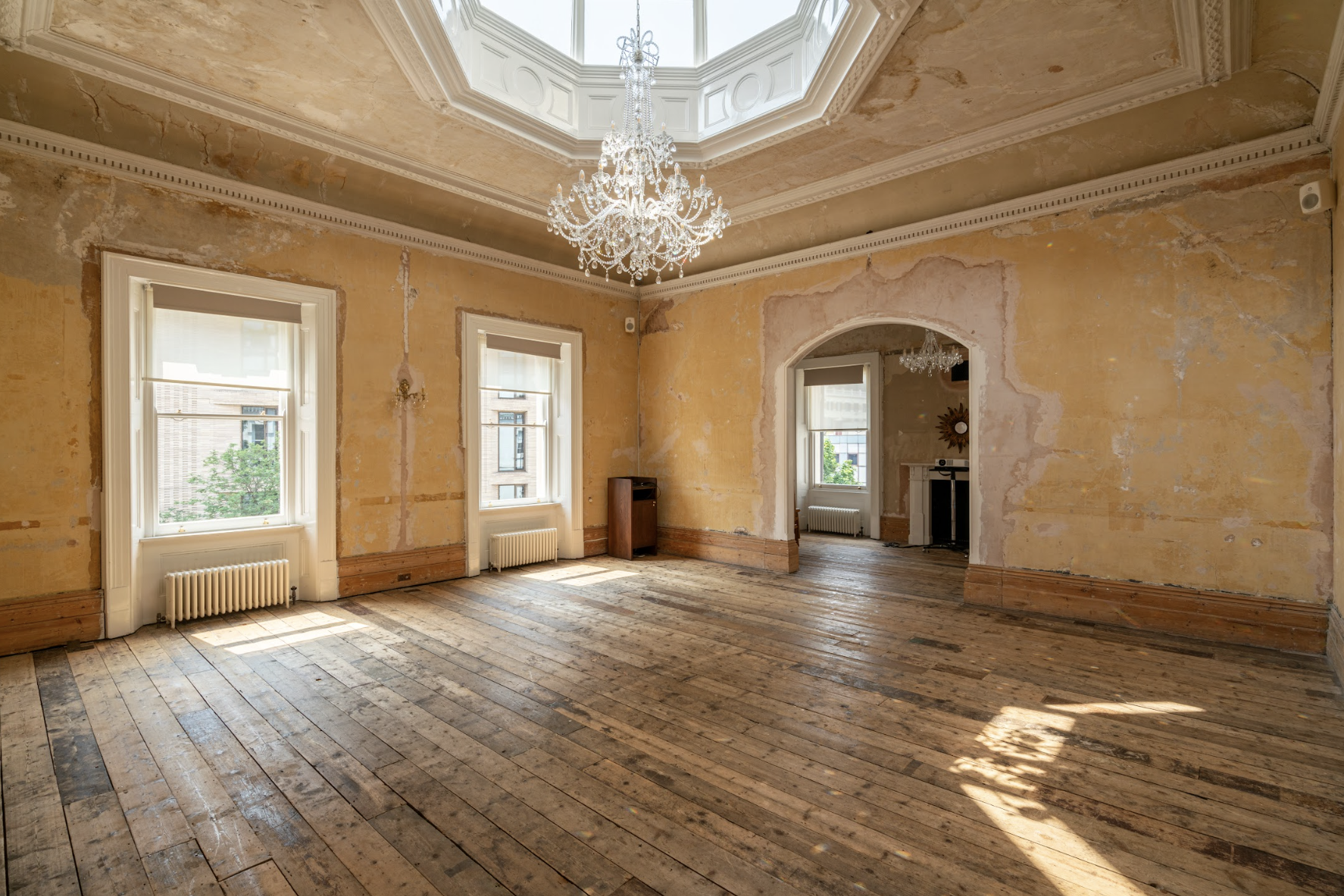 Spacious vintage event space with high ceilings and natural light at Knotel Workclub.