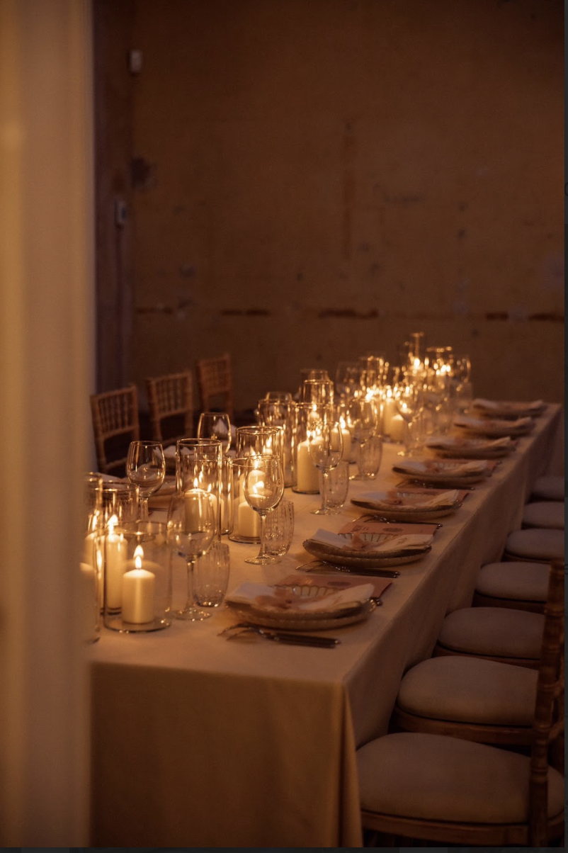 Elegant dining table with candlelight at Knotel Workclub for upscale events.