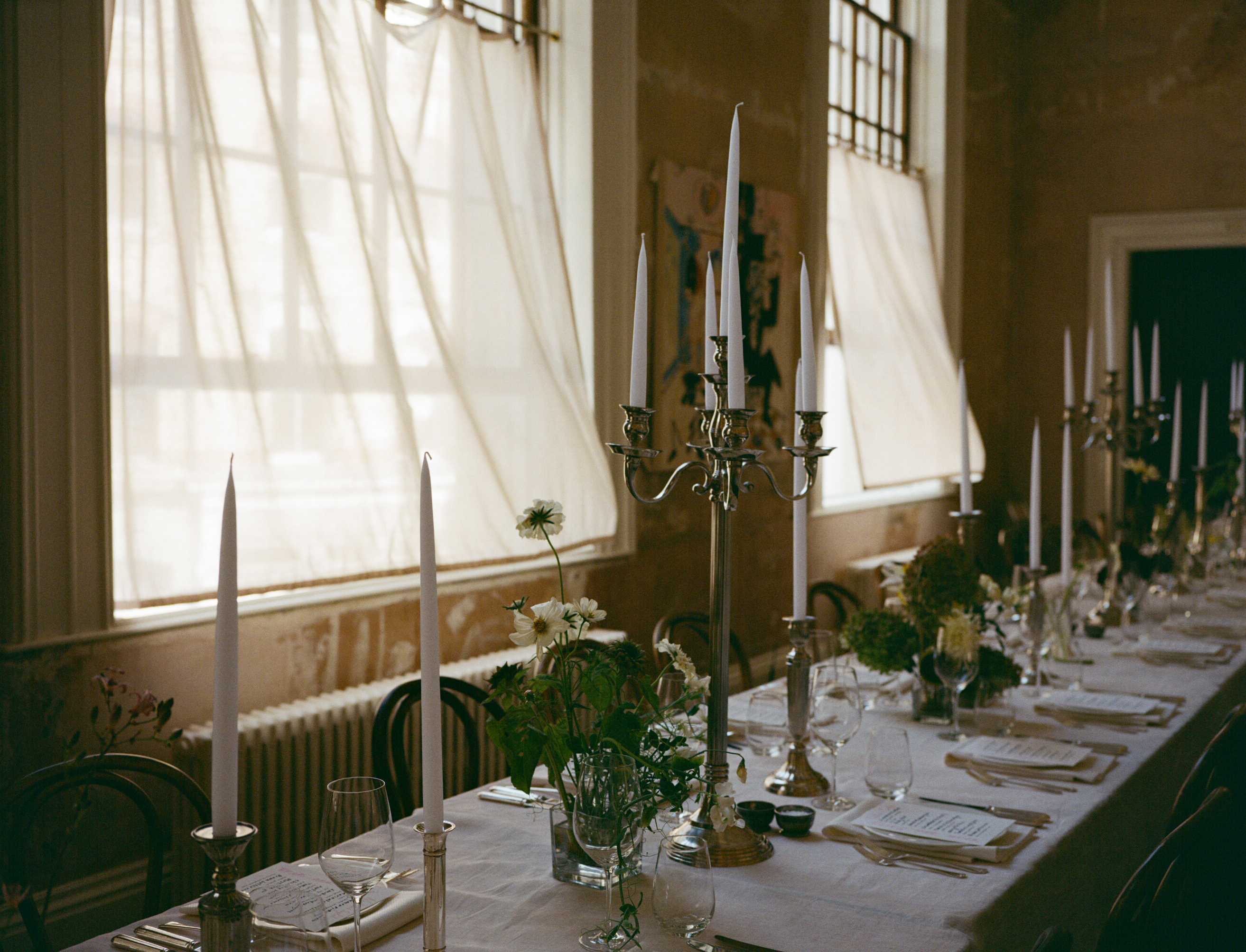 Elegant wedding table setting with candelabras at Knotel Workclub, ideal for upscale events.