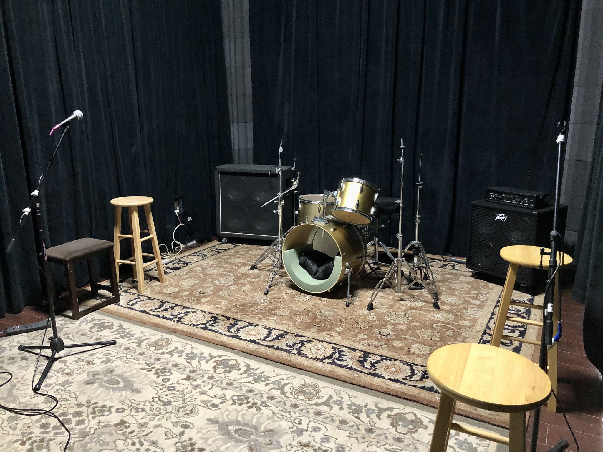 Intimate live music stage with drum kit at Grooveworks Studios, perfect for events.