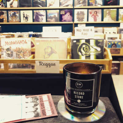 Cozy record store with vinyl displays, perfect for music events and listening parties.