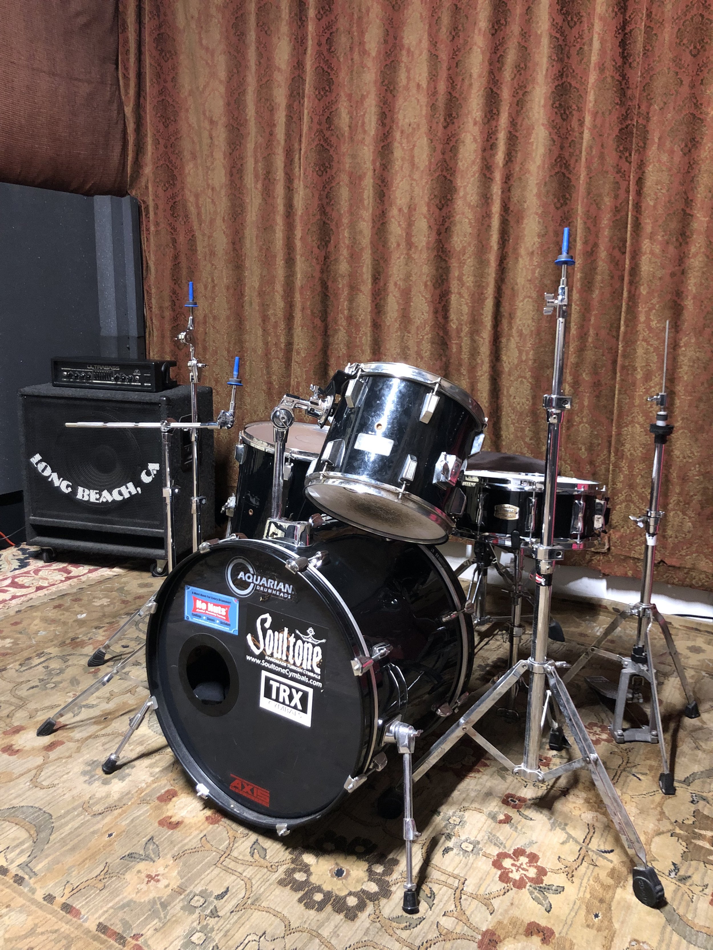 Control Room at Grooveworks Studios with a drum set for live music events.