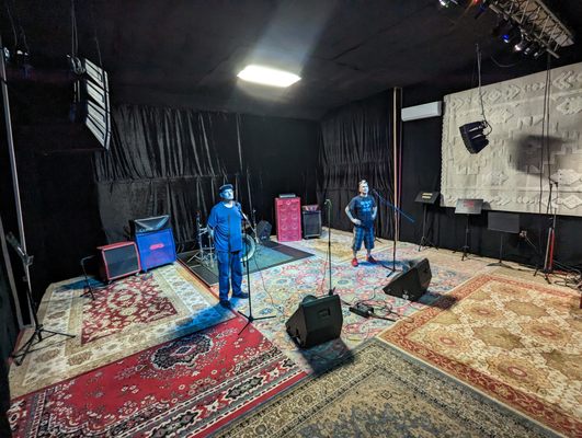 Control Room at Grooveworks Studios with performers, ideal for live music events.