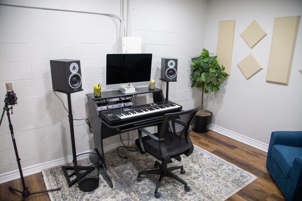 Large Rehearsal Room with audio setup, ideal for music production and workshops.