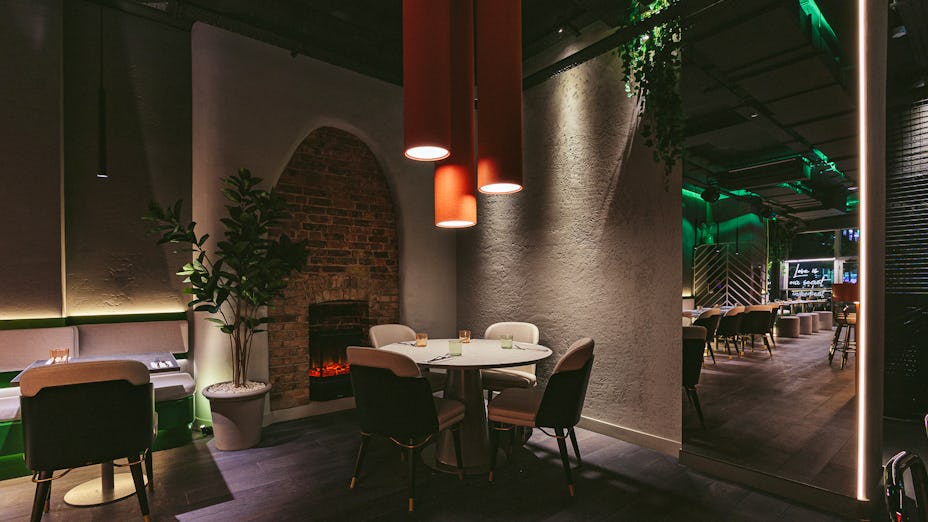 Private room at Bennie Restaurant & Bar, modern decor, ideal for intimate events.