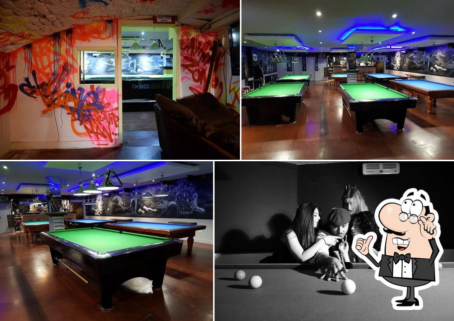 Vibrant pool hall with graffiti, ideal for networking events and team-building activities.