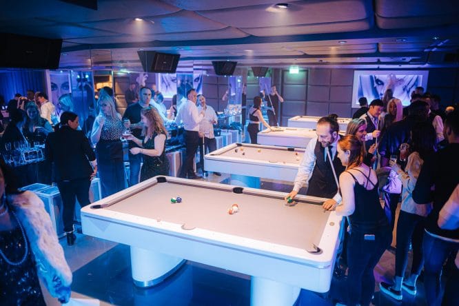 Vibrant event space with pool tables for networking and social gatherings.