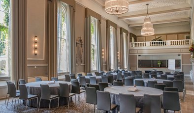 Hampton Suite at De Vere Beaumont Estate, spacious event room with chandeliers for conferences.