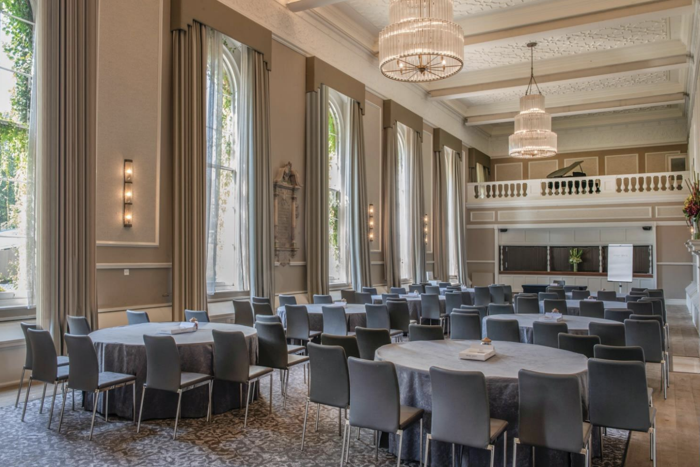Hampton Suite at De Vere Beaumont Estate, elegant chandeliers, ideal for conferences and banquets.