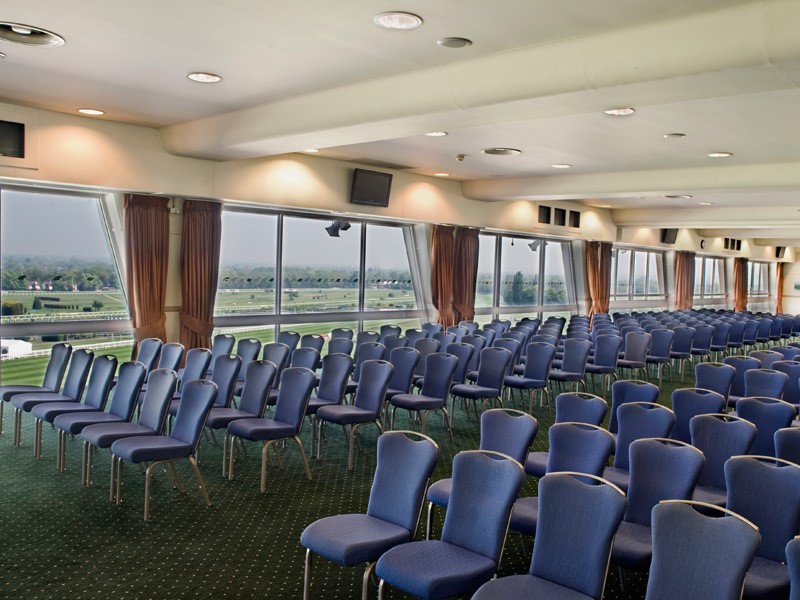 Gold Cup Suite at Sandown Park: spacious venue with blue chairs for conferences.