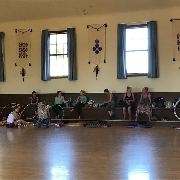 Hula hoop workshop in a bright, spacious Finnish Hall auditorium for community events.