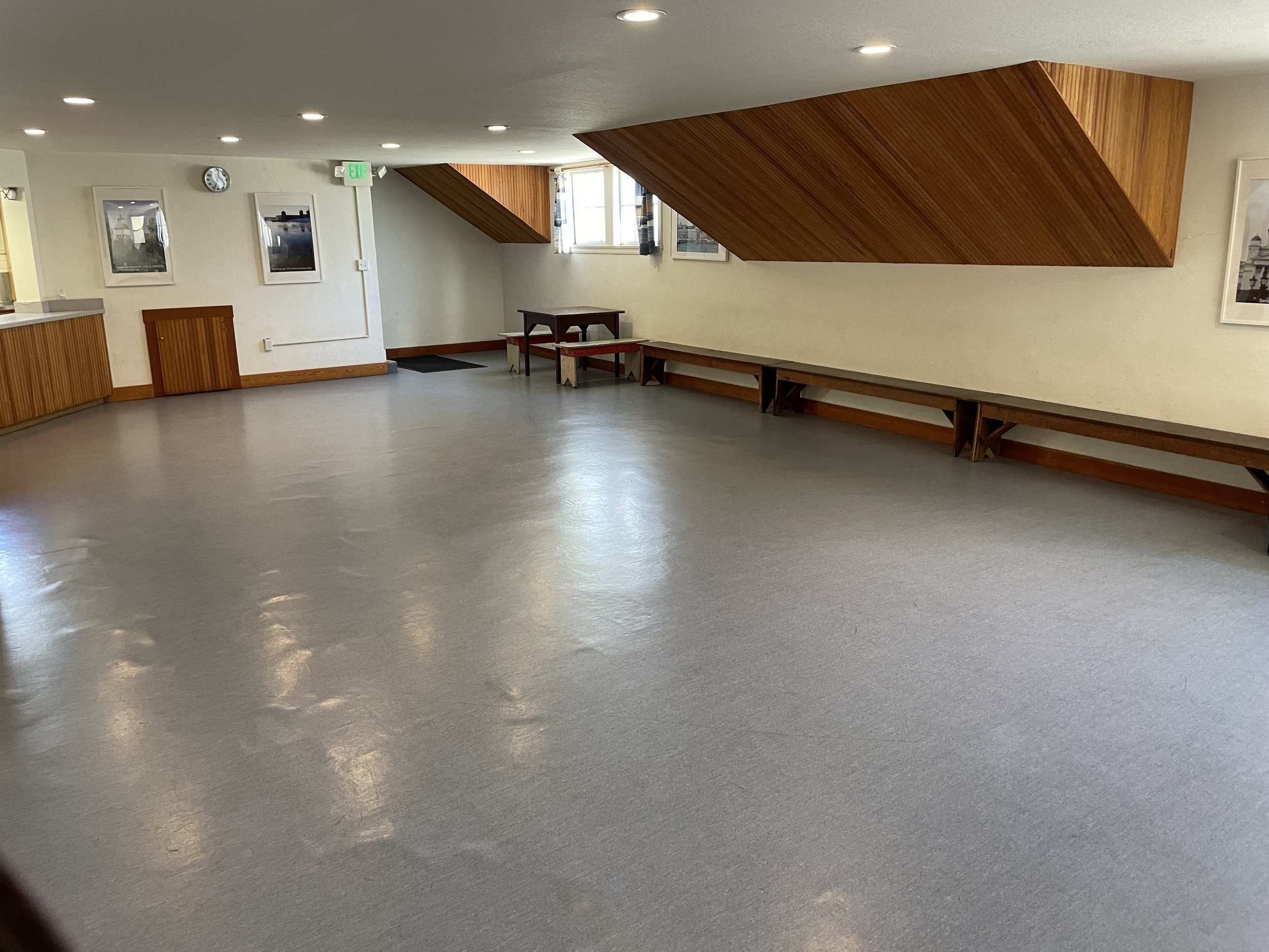 Versatile Finnish Hall auditorium with natural light, ideal for workshops and meetings.