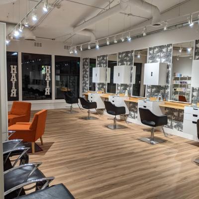 Modern salon space with stylish chairs, ideal for beauty workshops and networking events.