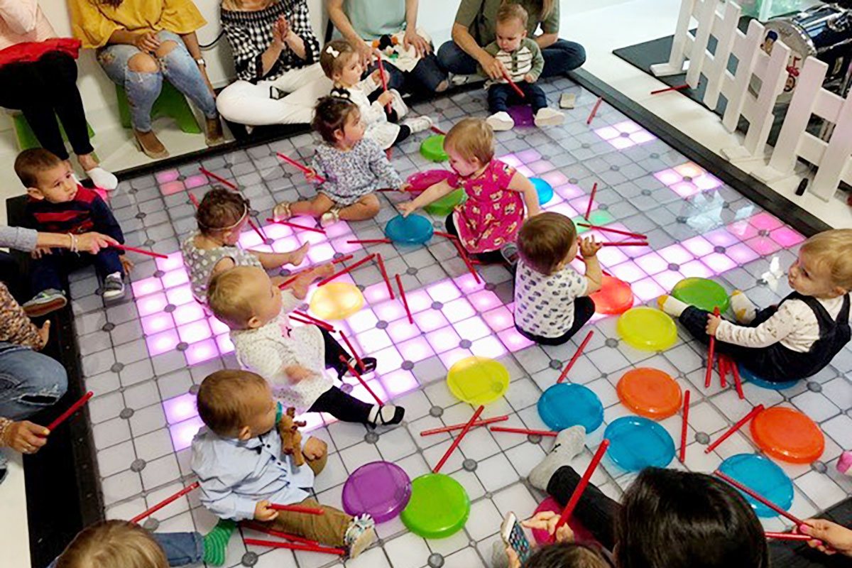 Vibrant children's play area with colorful mats for family-friendly events and birthday parties.