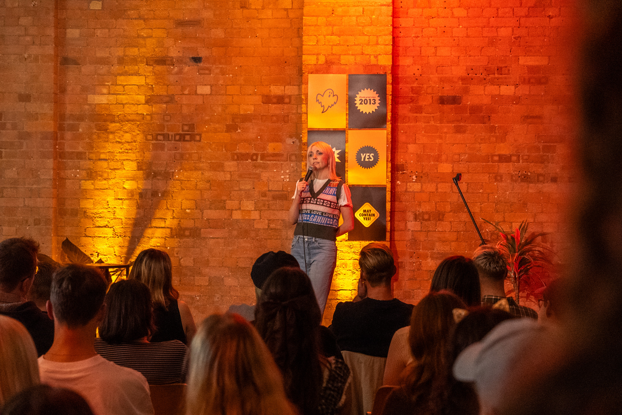 Dynamic speaker engaging audience in warm Kachette Shoreditch venue, ideal for events.