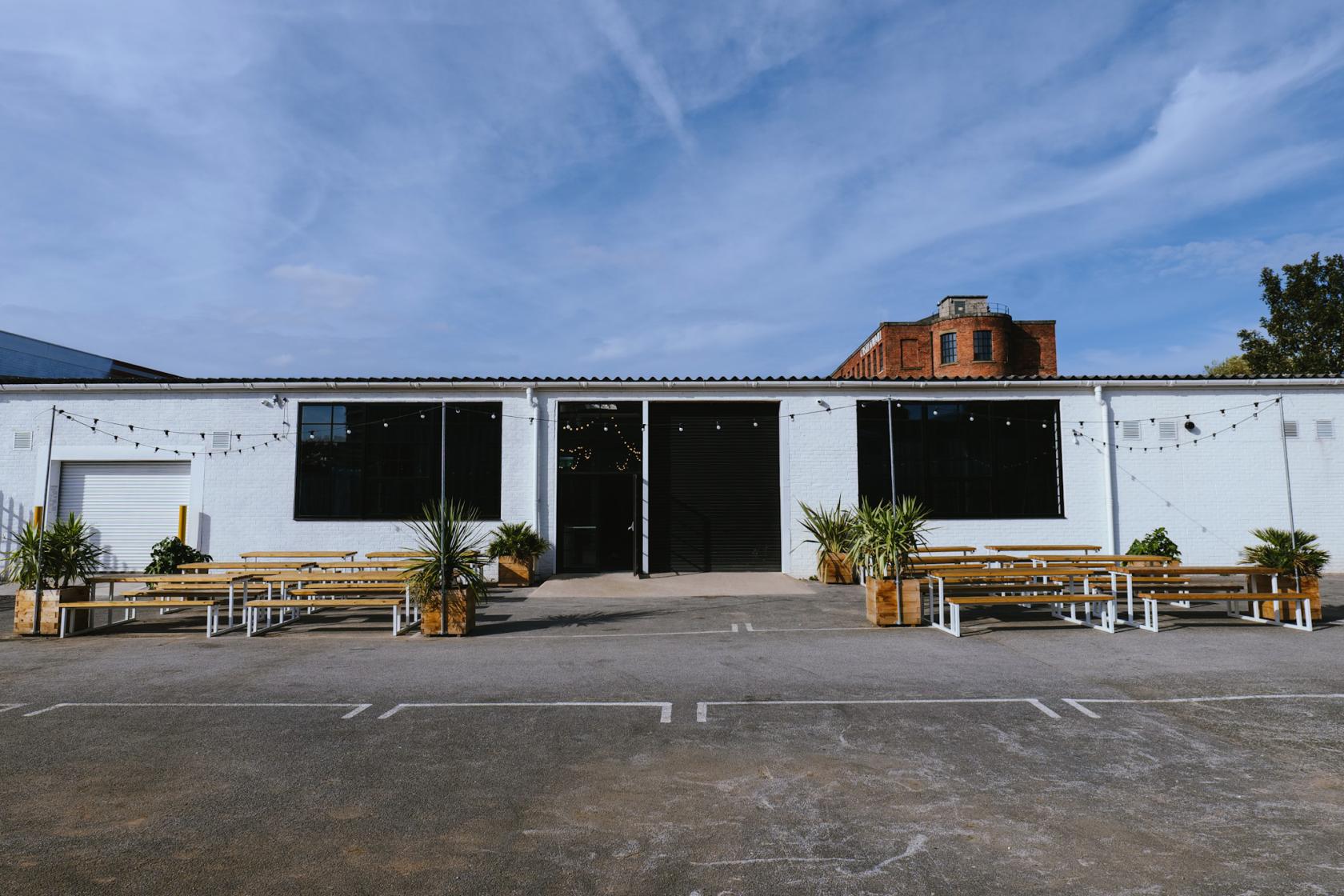 Modern event space with large windows, perfect for corporate meetings and social gatherings.