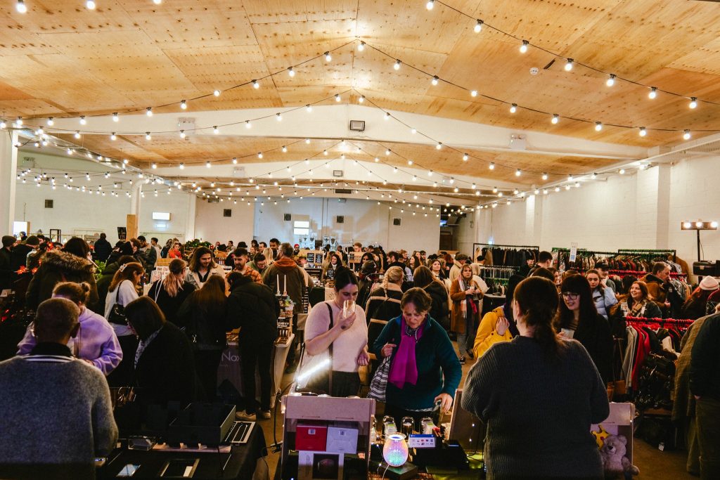 Outdoor event space with string lights, perfect for networking and vendor showcases.