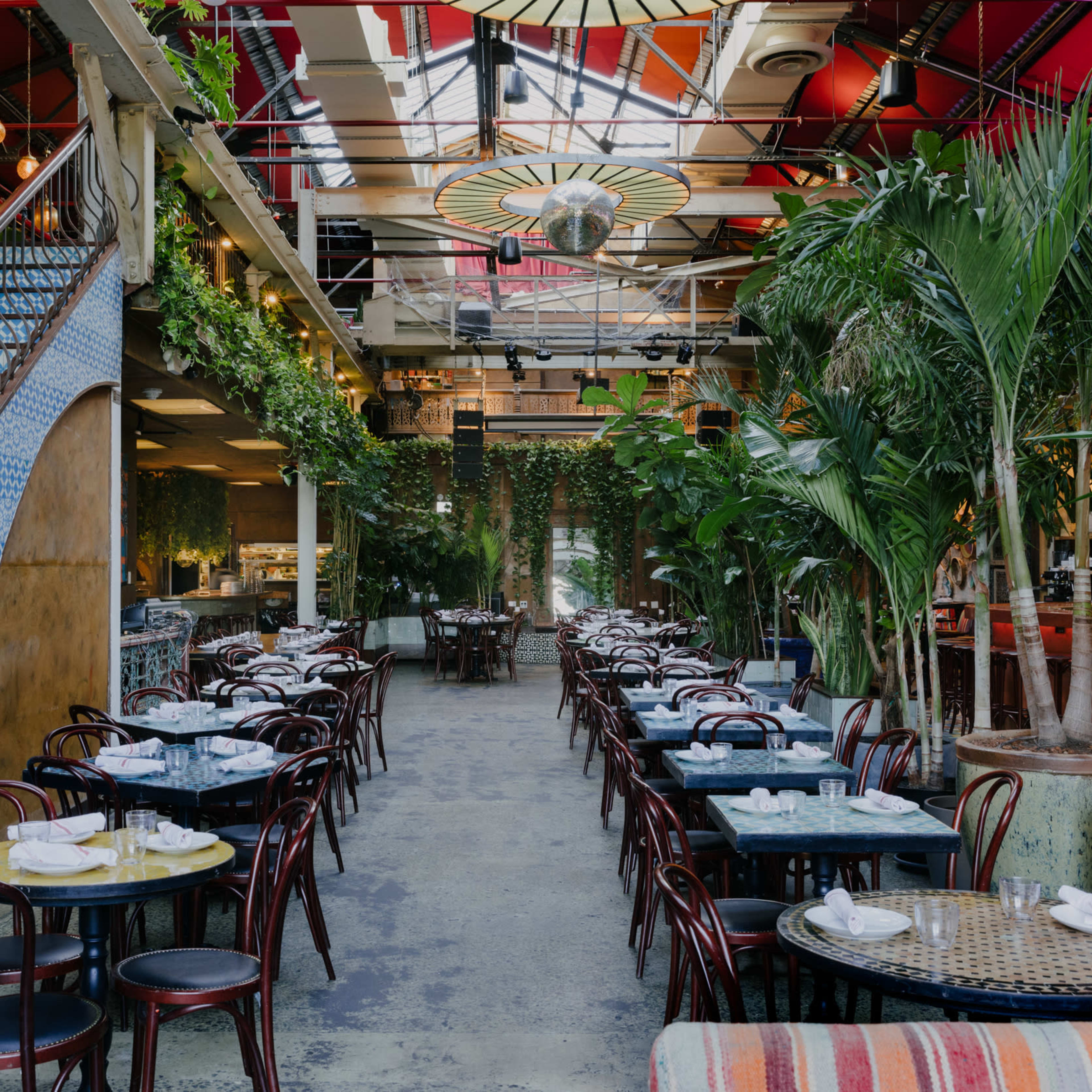 Vibrant event space with lush greenery for elegant birthday and corporate celebrations.