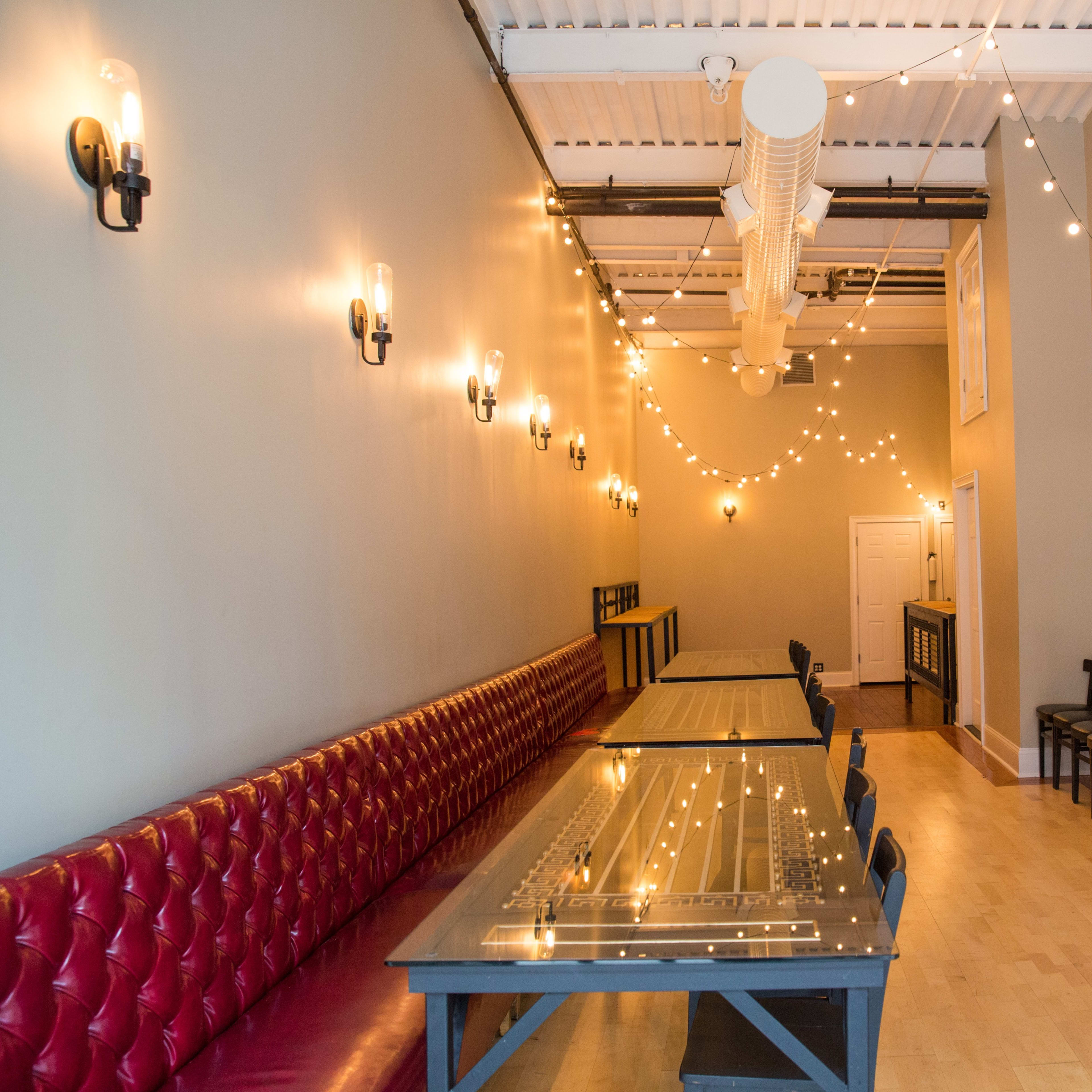 Elegant birthday event space with stylish table setup and cozy seating for gatherings.