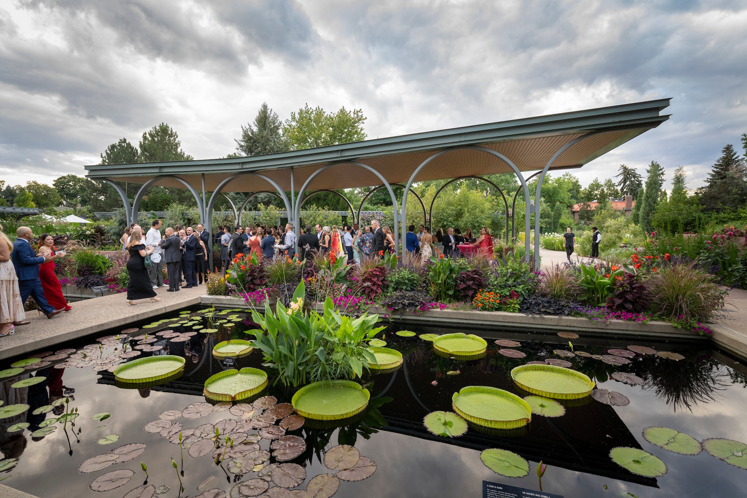 Elegant outdoor product launch at Fêtes de Fleur with lush greenery and vibrant flowers.