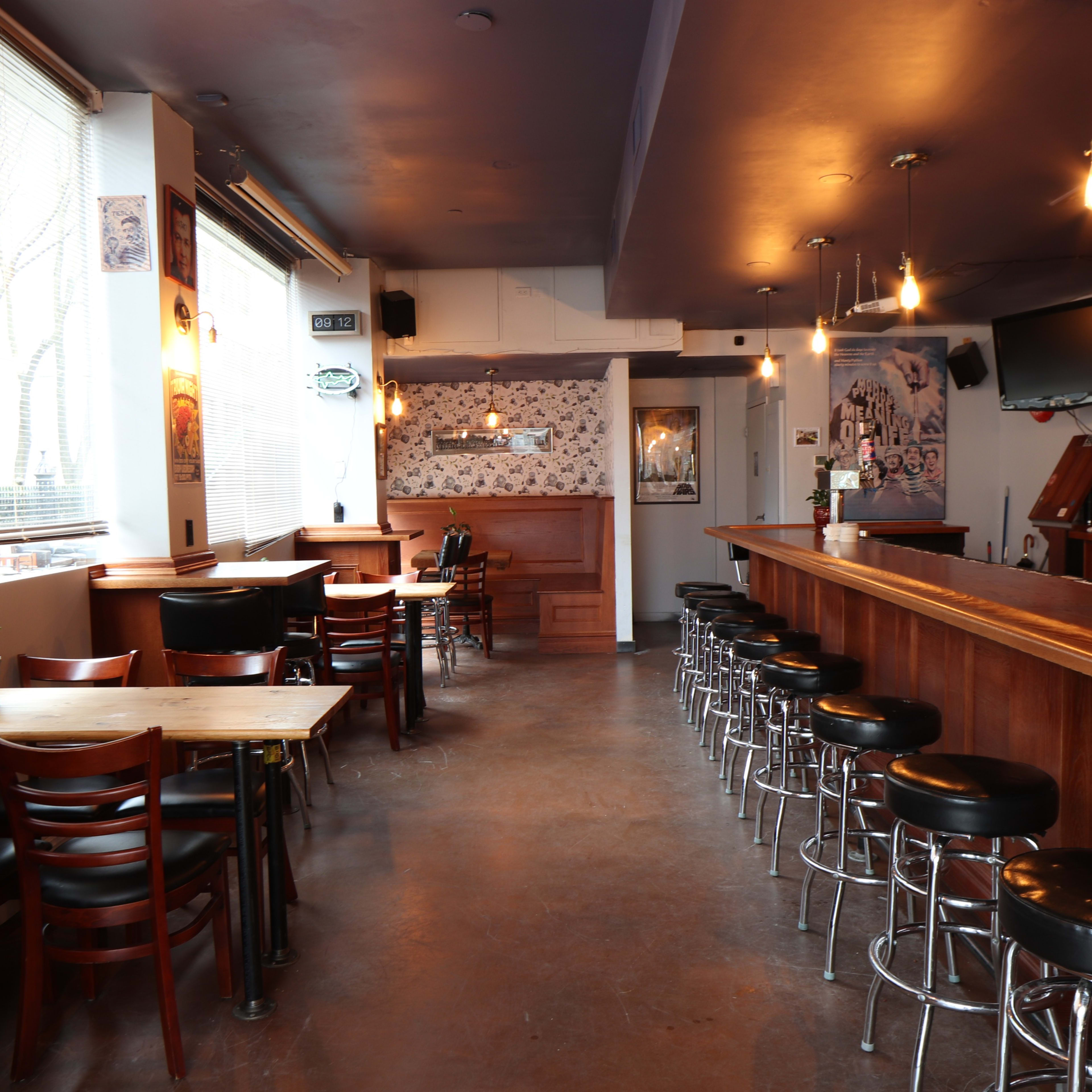 Versatile event space with bar, ideal for casual gatherings and networking events.