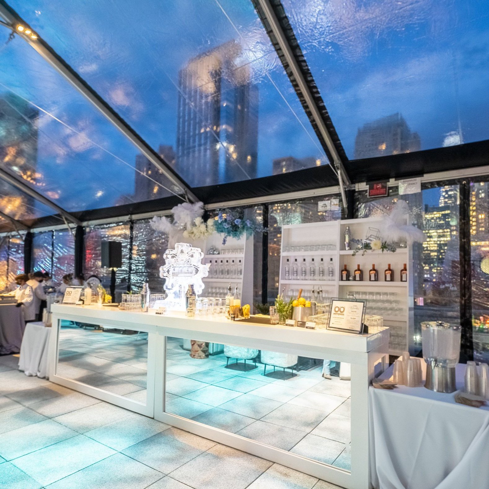City View Room event setup with elegant bar and city lights for networking gatherings.