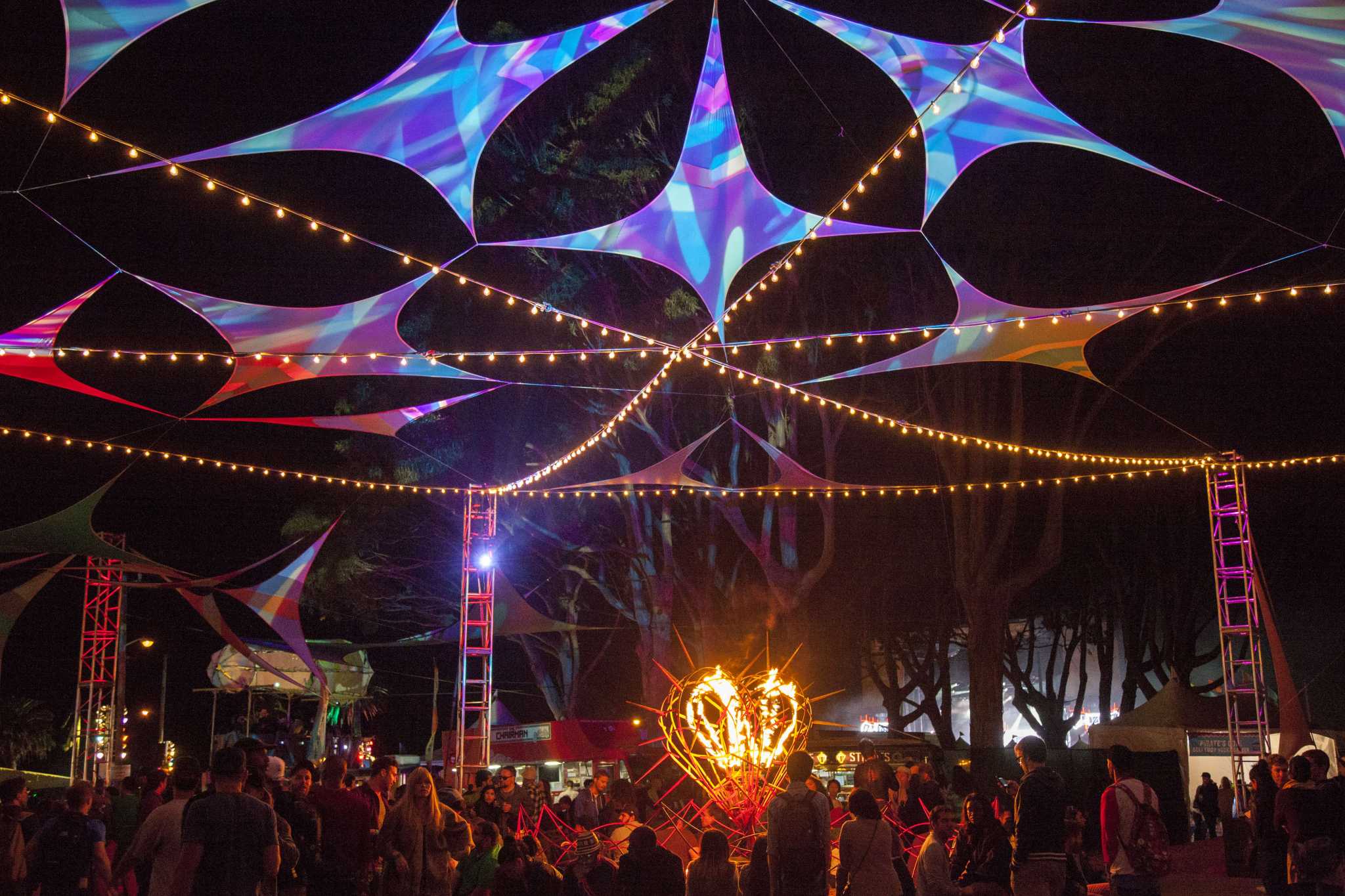 Vibrant outdoor event space at Treasure Island with colorful lights for festivals.