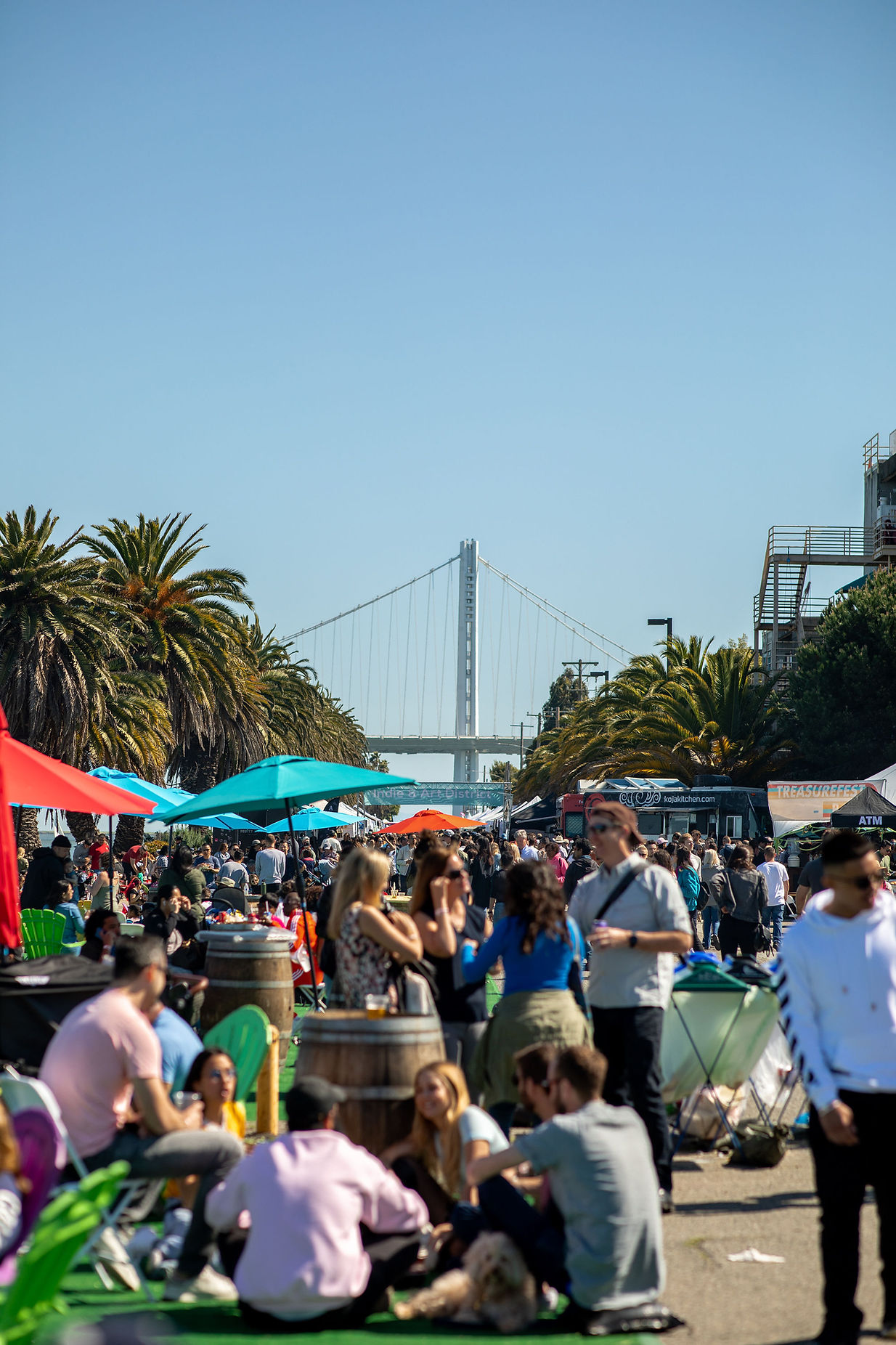 Treasure Island outdoor event with colorful umbrellas, ideal for networking and community building.