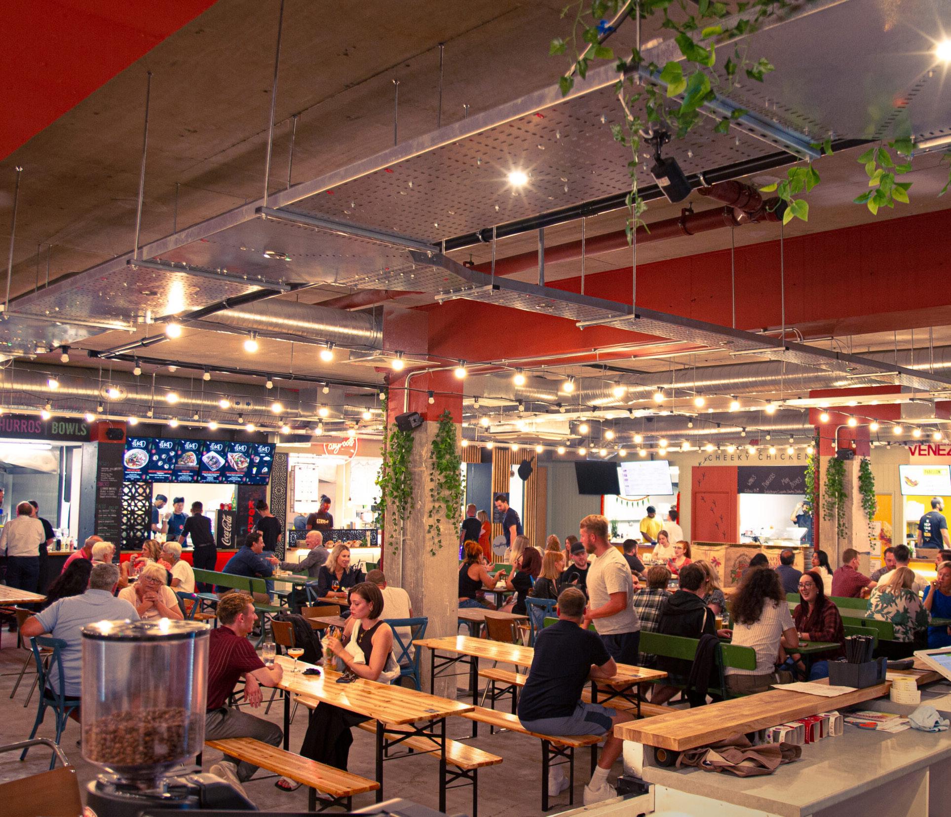 Vibrant Epsom Social food court with communal seating for networking events and gatherings.